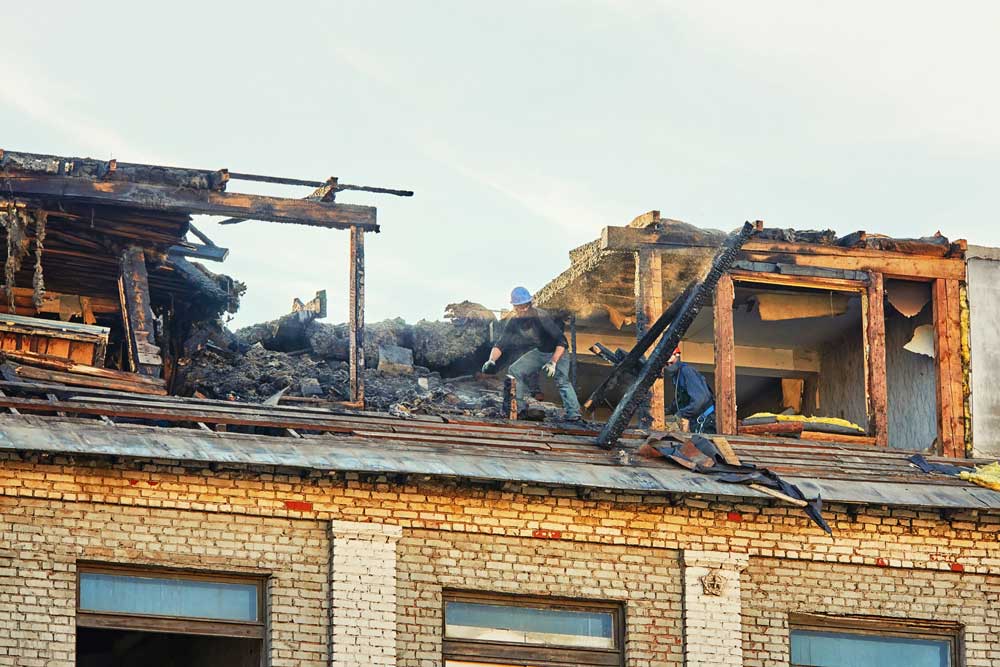 Roof damaged by fire requiring residential restoration repair